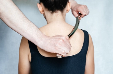 Woman Receiving Graston Therapy